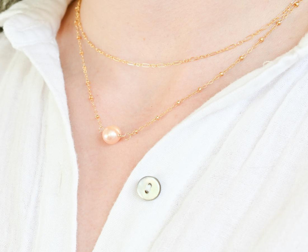 Freshwater pearl necklace paired with stackable gold filled chain (etsy image id: 7329849392)