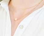 Freshwater pearl necklace paired with stackable gold filled chain (etsy image id: 7329849392)