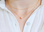 Freshwater pearl necklace paired with stackable gold filled chain (etsy image id: 7329849472)